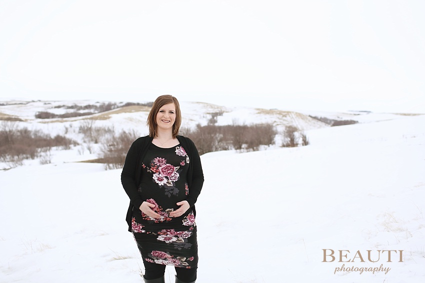 BEAUTI photography Tribune Saskatchewan lifestyle photographer outdoor maternity photography winter portraits snowy trees winter maternity session prairie pasture floral crown photo