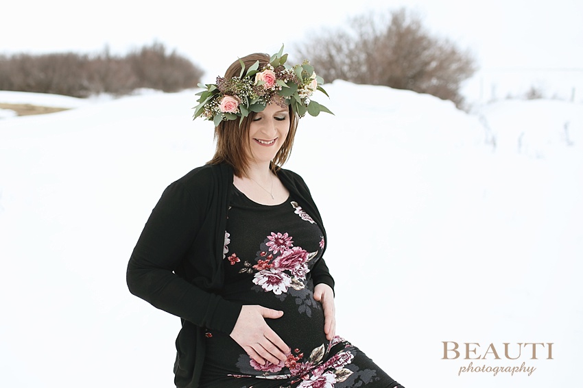 BEAUTI photography Tribune Saskatchewan lifestyle photographer outdoor maternity photography winter portraits snowy trees winter maternity session floral crown beautiful mother photo