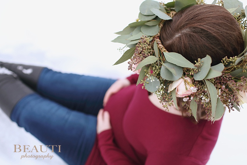BEAUTI photography Tribune Saskatchewan lifestyle photographer outdoor maternity photography winter portraits snowy trees winter maternity session floral crown baby belly photo