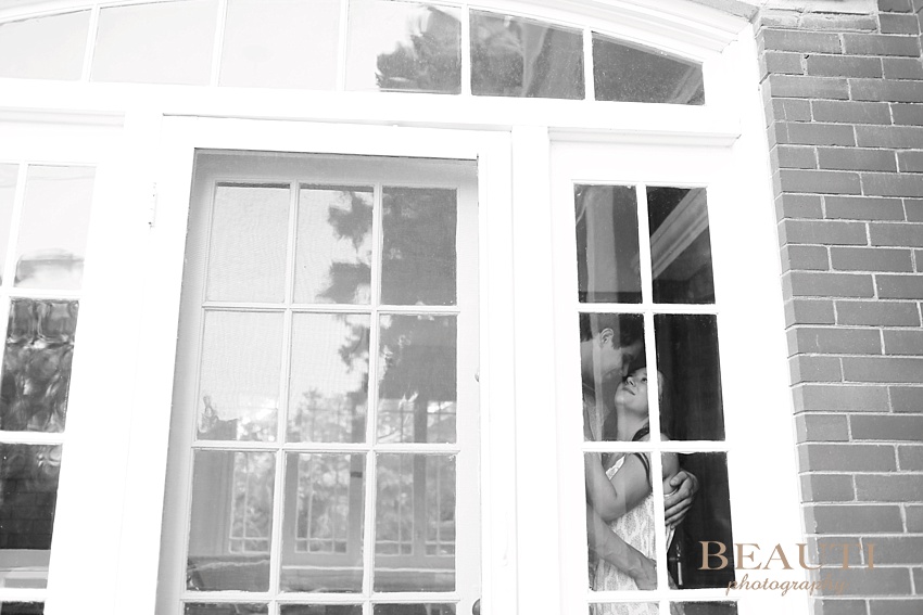 Weyburn engagement photographer newly engaged Sask wedding photographer heritage Eaglesham house through the windows photo