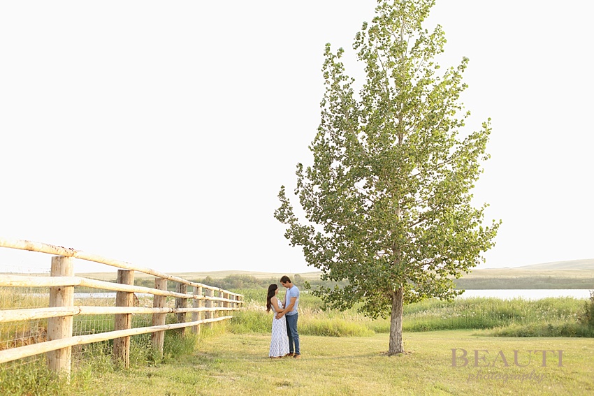 Weyburn engagement photographer newly engaged Sask wedding photographer Nickle Lake summer engagement session photo