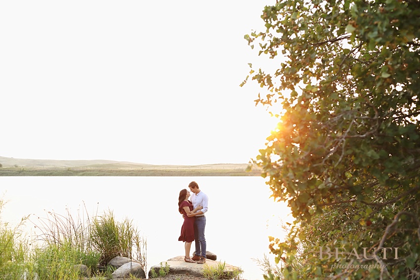 Weyburn engagement photographer newly engaged Sask wedding photographer Nickle Lake summer engagement session lakeview sunset photo
