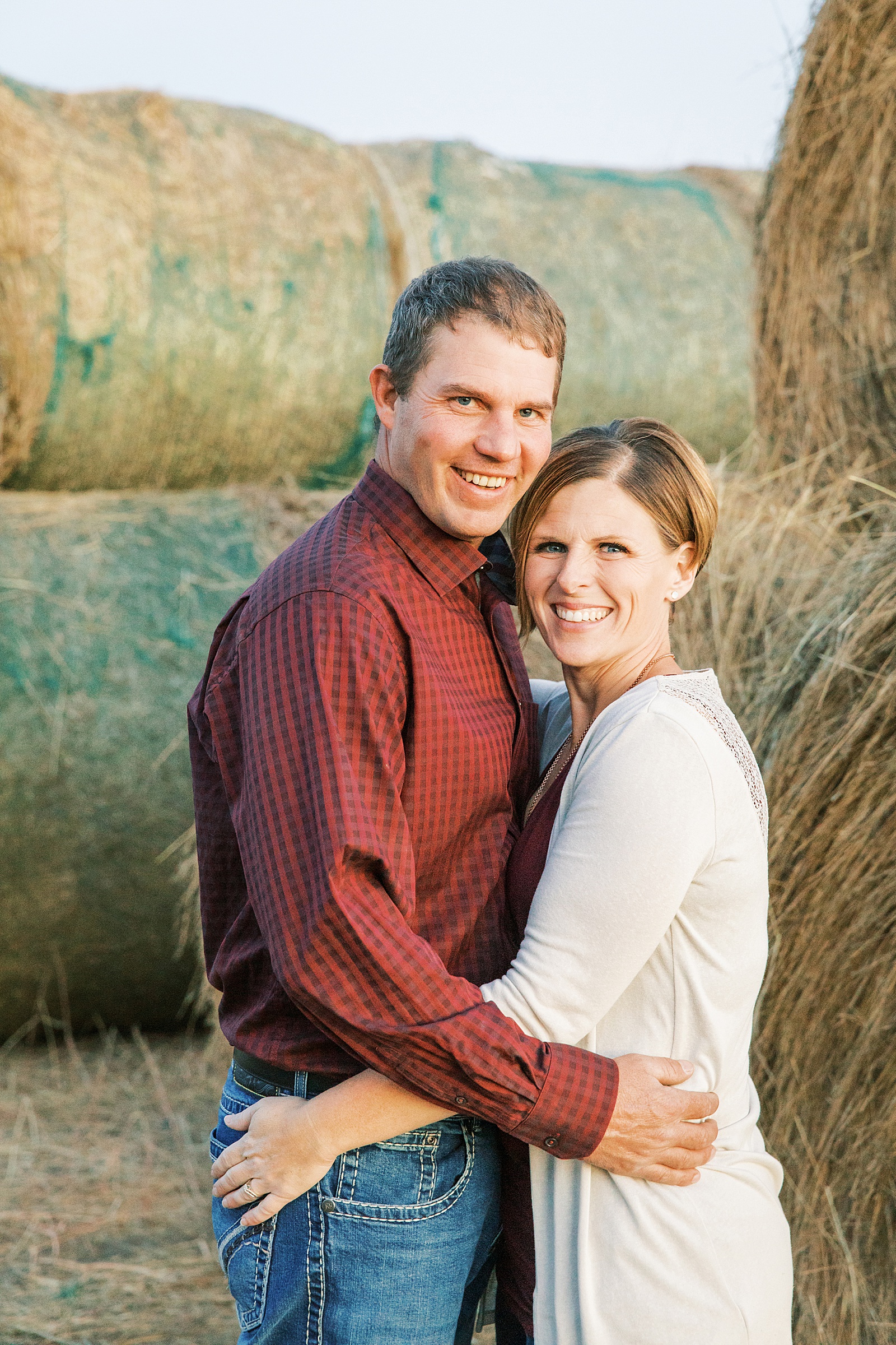 Jenelle Quigley Photography family lifestyle photographer Tribune Saskatchewan couple portraits hay bales