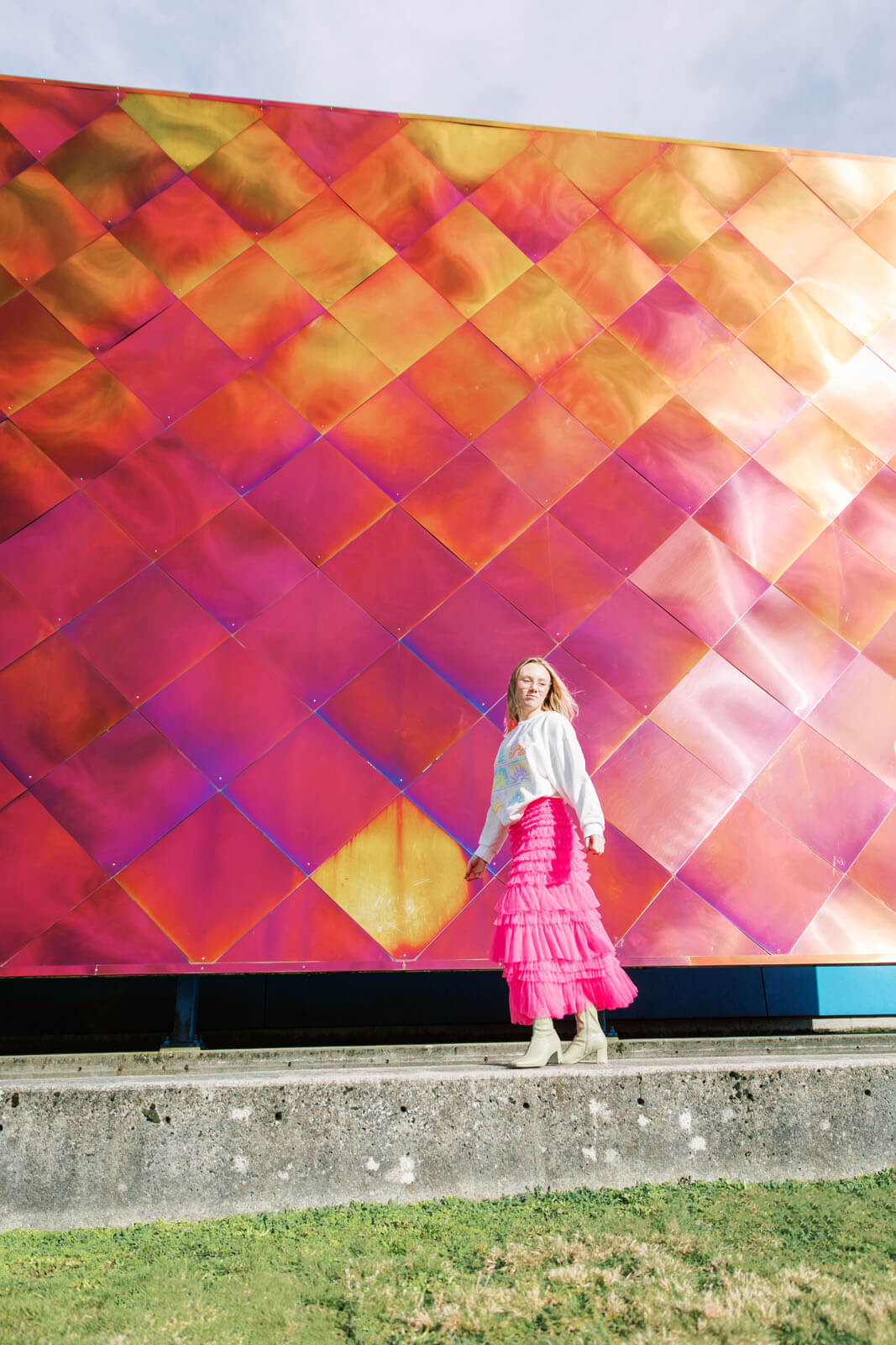 Jenelle Quigley Photography Nanaimo Vancouver Island British Columbia lifestyle photographer pink wall pink skirt young lady walking