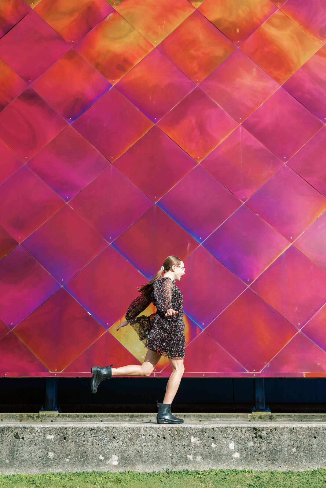 Jenelle Quigley Photography Nanaimo Vancouver Island British Columbia lifestyle photographer pink wall pink skirt jumping young lady Happy Love Day