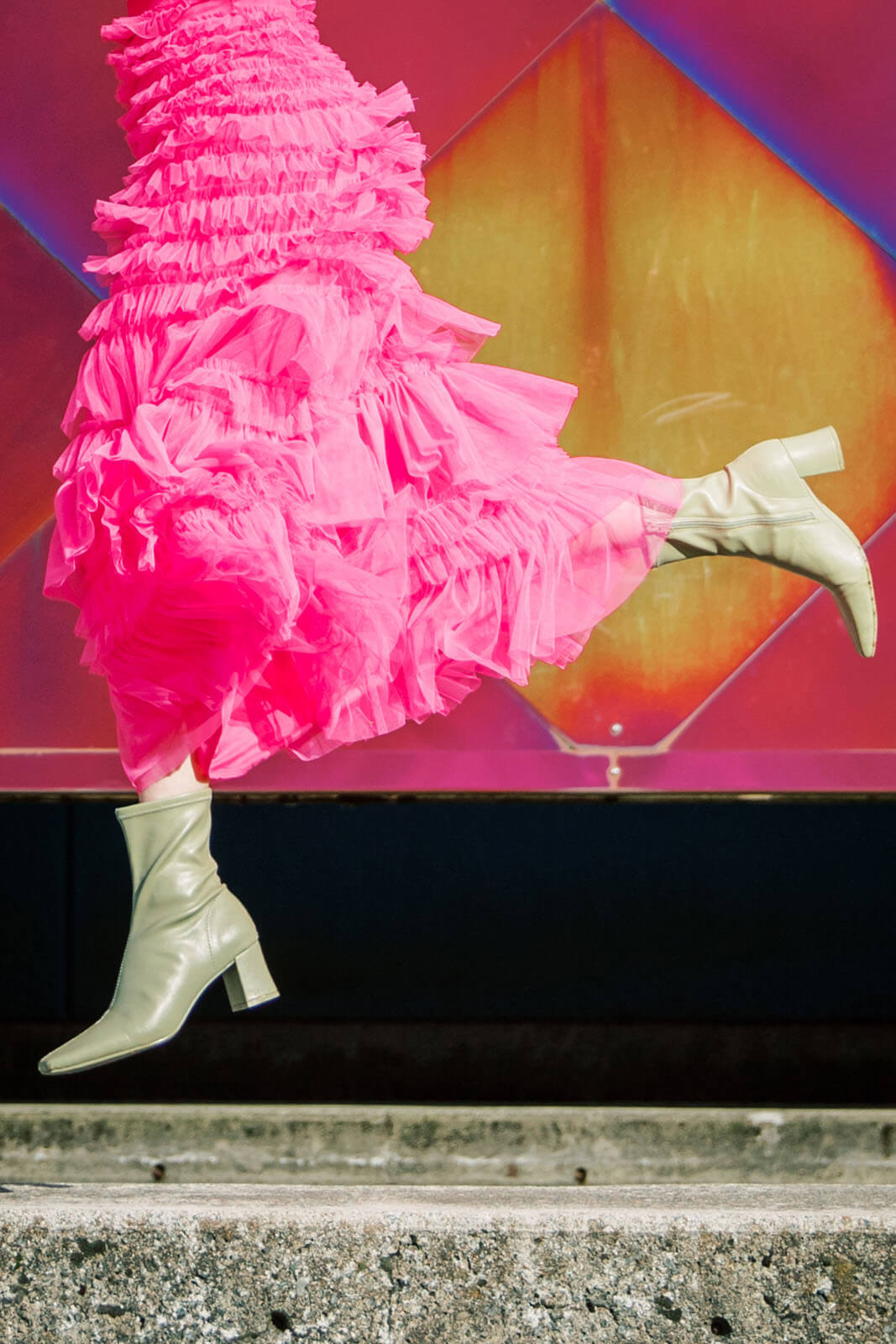 Jenelle Quigley Photography Nanaimo Vancouver Island British Columbia lifestyle photographer pink wall pink skirt jumping young lady Happy Love Day