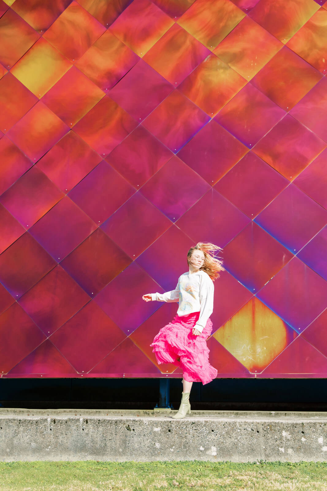 Jenelle Quigley Photography Nanaimo Vancouver Island British Columbia lifestyle photographer pink wall pink skirt jumping young lady Happy Love Day