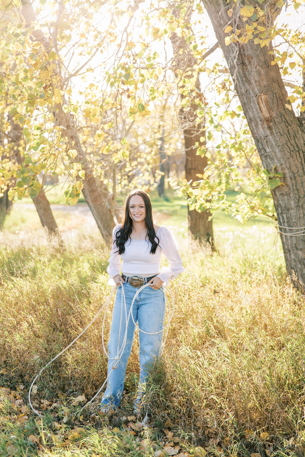 Jenelle Quigley Photography Saskatchewan lifestyle photographer fall grad casuals in Radville class of 2024 western theme rodeo horses