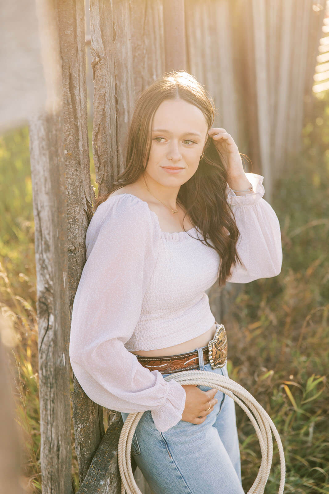 Jenelle Quigley Photography Saskatchewan lifestyle photographer fall sunset class of 2024 western belt buckle lariat roping