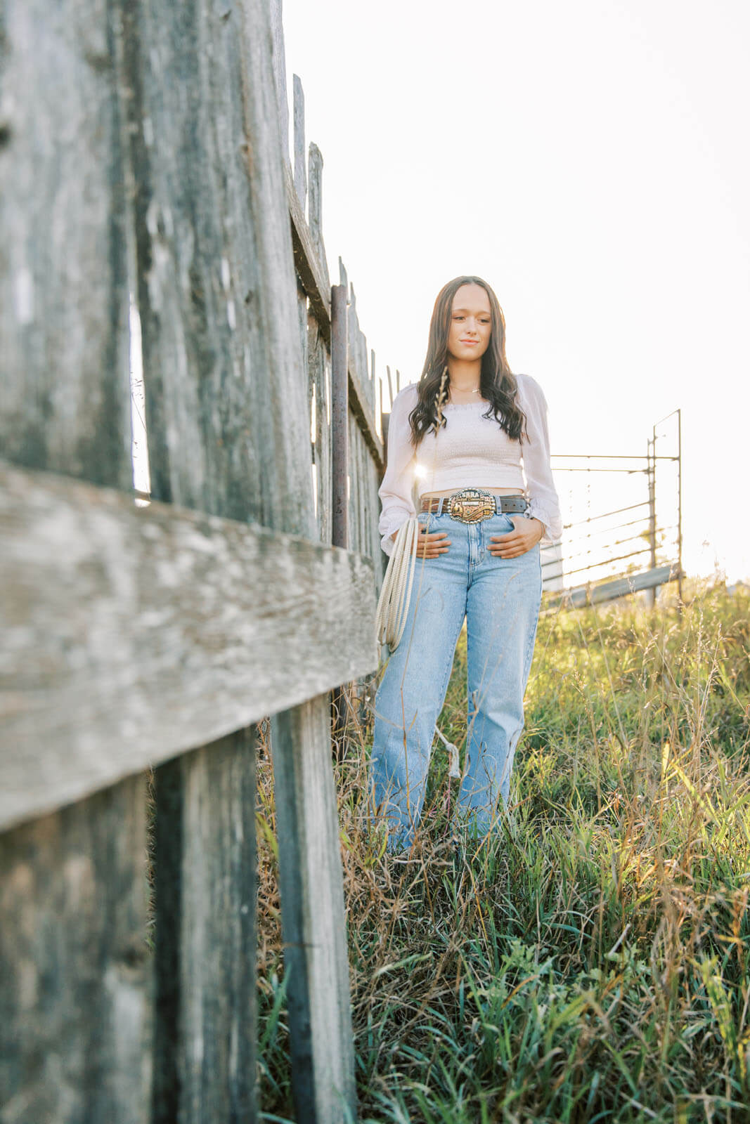 Jenelle Quigley Photography Saskatchewan lifestyle photographer fall sunset class of 2024 western belt buckle lariat roping