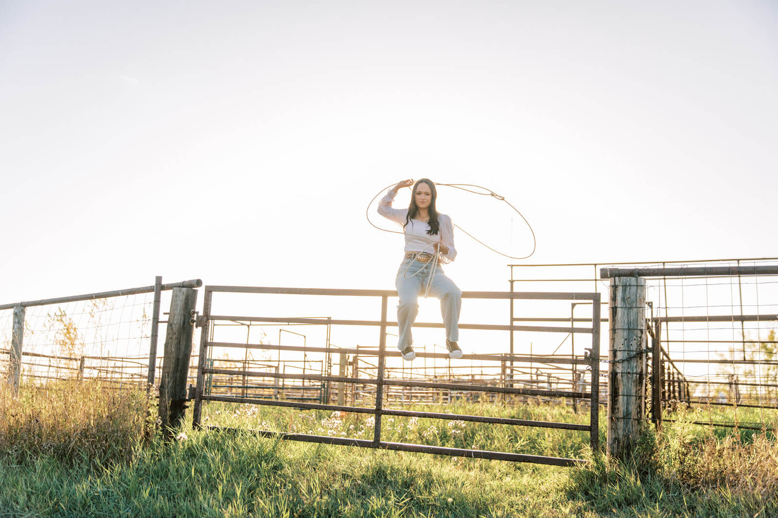 Jenelle Quigley Photography Saskatchewan lifestyle photographer fall sunset class of 2024 western belt buckle lariat roping