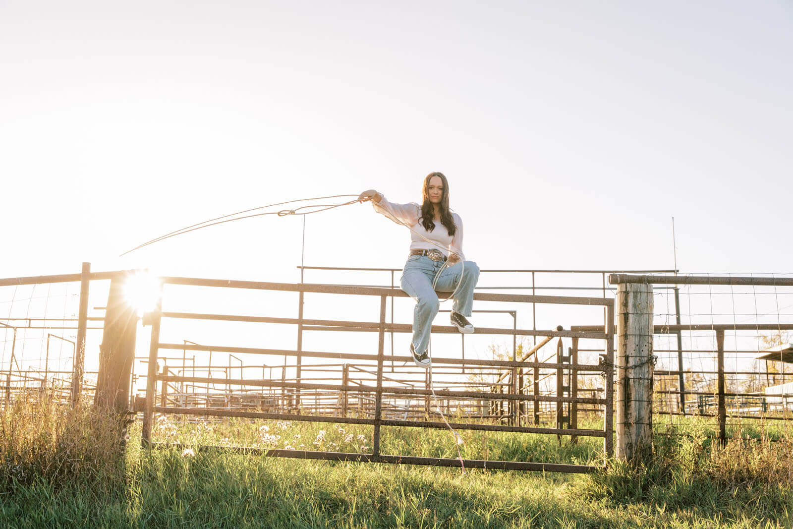 Jenelle Quigley Photography Saskatchewan lifestyle photographer fall sunset class of 2024 western belt buckle lariat roping
