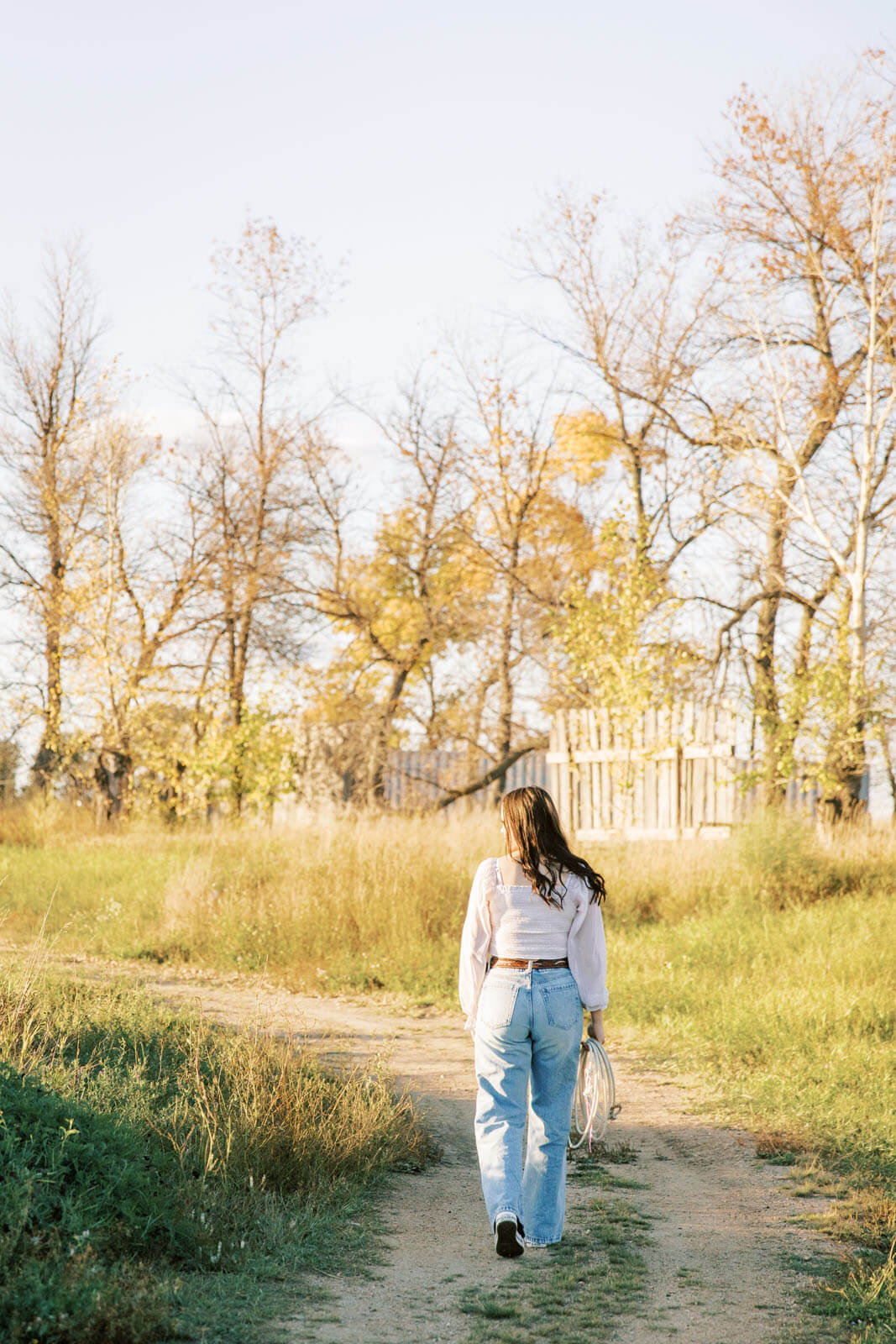 Jenelle Quigley Photography Saskatchewan lifestyle photographer fall sunset class of 2024 western belt buckle lariat