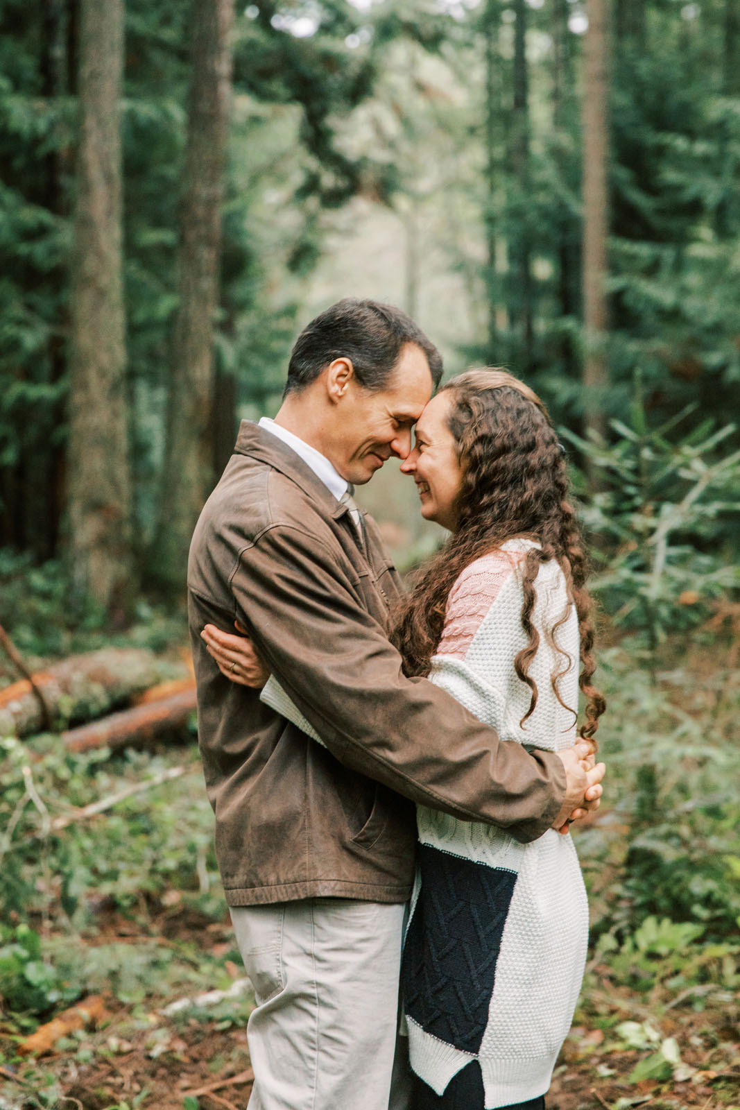 Jenelle Quigley Photography British Columbia lifestyle photographer forest acreage couple laughing portraits